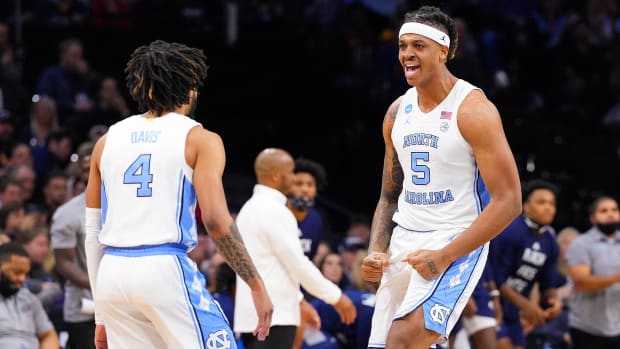 UNC’s Armando Bacot celebrates with a teammate.